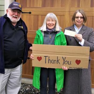 Belfast Rotary Club’s secretary Syrena Gatewood (r.) and president John Golden (l.) present a $2,000 check to the Greater Belfast Area Ministrium Food Cupboard, one of five recent gifts to food pantries. (Photo courtesy Phil Carthage, Belfast Rotary Club)