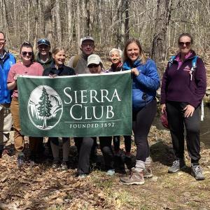 Participants pose for a group shot during Sierra Club Maine’s Eliot Town Forest Earth Day Hike, led by Tomas Dundzila. (Photo courtesy Sierra Club Maine)