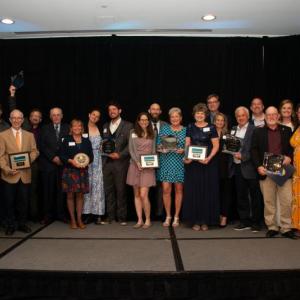 2022 Gala Honorees - Many of the Gala honorees gathered for a group shot at the end of the evening. (L to R) - Tom Peaco, Chamber President & CEO; JR Braugh, Schooner Ladona; Richard Lyon, Pen Bay Medical Center; Noah Barnes, Schooner Stephen Taber; Mark Hedrich, Knox-Lincoln Soil & Water District; Deborah Meehan, 2022 Community Person of the Year; Becky Wright and Nathan Segouin, Schooner Lewis R. French; Lauren Soutiea and Greg Soutiea, Craignair Inn by the Sea and Causeway Restaurant; Celia Knight, Maine Lobster Festival; Shari Closter; Cliff Winn, Coastal Opportunities; Liz Sullivan and Steve Anderson, The Apprenticeshop; Jon Duke, Town of Rockport/Rockport Public Library; Leni Gronros and Kim Graffam, Graffam Bros. Seafood; Sheila Lowe, Chamber Board Chair (in between Leni and Kim). (Photo courtesy Carol Miller Photography carolmillerphotos.com)