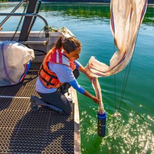 University of Maine student researcher Autumn Lauria samples plankton from the deck of the R/V Ira C. in 2019. (Photo courtesy University of Maine)