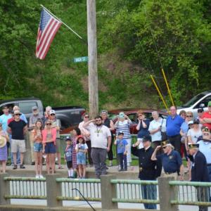 On the Goose River Bridge, the parade halted, and the Color Guard tossed a wreath into Rockport Harbor to honor those who sacrificed their lives for their country, Rev. Dave Franclemont, District 6 Chaplain, delivered an invocation, and a rifle volley was sent out to sea.
