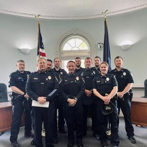 Pictured: Chief Robert Cormier, center, and members of the Belfast Police Department, including Deputy Chief Dean Jackson, Sergeant Matthew Cook, Sergeant Lewis Dyer, Sergeant Daniel Thompson, School Resource Officer Rick Smith, Officer Megan Tribuzio, Officer Jonathan Guba, Officer Jeremy Bell, and Officer Andrew Chapman. (Photo courtesy Belfast Communications Assistant Mackenzie Barnhart)