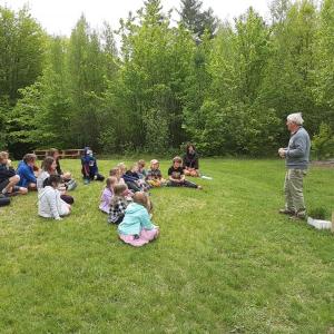 Tom King and Marianne McKinney with students at Cornerspring Montessori School. (Photo courtesy Belfast Bay Water Coalition)