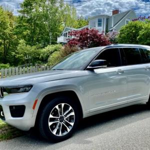 The redesigned Grand Cherokee is longer, wider, taller and more expensive than its predecessor. This color is Silver Zynith over Global Black.