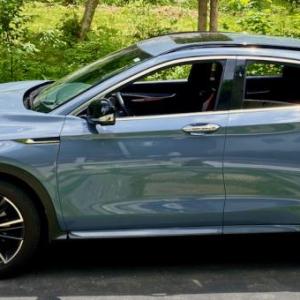 Even in this muted but rich Slate Gray, the QX55’s sleek silhouette stands out. Yes, the sloping roof cuts into rear headroom and cargo space, but front-seaters are in the lap of luxury.