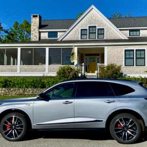 Type S upgrades transform the full-size MDX into a three-row sporter. Lunar Silver with black trim shows off the vehicle’s crisp styling—and no one can miss the four big exhaust pipes poking out behind, either.