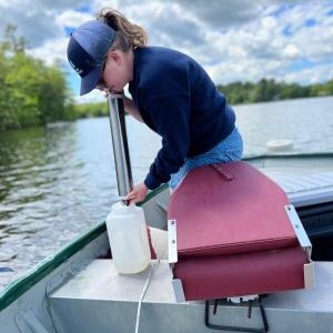 Midcoast Conservancy’s Damariscotta Lake Watershed Manager Patricia Nease monitors water quality near Damariscotta Mills. (Photo courtesy Midcoast Conservancy)
