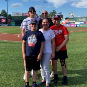 Cameron Frisone, 13, of Rockland, poses with his family after running the bases prior to the July 2 Portland Sea Dogs game at Hadlock Field. The Frisone Family from left to right: Dominic, Vincent, Mike, Erin, and Cameron Frisone. (Photo courtesy Anthem Blue Cross and Blue Shield)