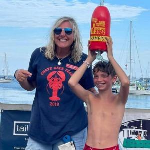 Maine Lobster Festival Director Shannon Kinney with International Great Crate Race Champion Aiden Genthner. Photo courtesy Maine Lobster Festival