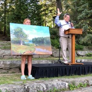 Kaja Veilleux auctioned "Shirttail Point Park" by Peter Yesis, which drew the afternoon's highest bid of $9,500. (Photo courtesy Camden Public Library)
