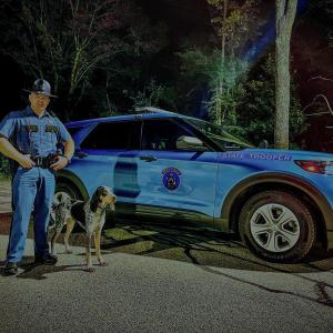 Whiskey and Maine State Police Trooper Matthew Williams.