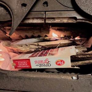 The first step in the morning routine – lighting a match to start the fire. (Photo by Diane O'Brien)