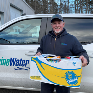 Maine Water employee Steve Soucy delivering the boxes earlier this month. (Photo courtesy Maine Water)