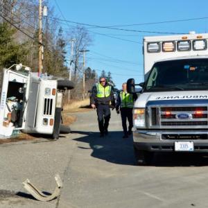 Rockport Police Officer Travis Ford and Camden-Rockport Police Chief Randy Gagne assess the two-vehicle crash on Route 1 Jan. 11. (Photo by Lynda Clancy)