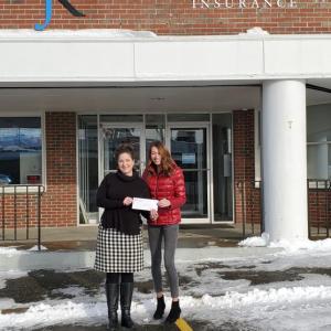 Amy Sutter of J. Edward Knight, Bath, Maine presents Sawyer Boulette, Special Olympics Maine Director of Unified Champion Clubs, a check of $3,000 to support the expansion of unified sports through Special Olympics Maine Unified Champion Clubs. (Photo courtesy J. Edward Knight)