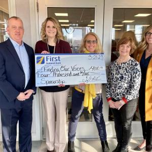 From left to right: First National Bank President and CEO Tony McKim; VP, Business Development Officer, Michelle Curtis; Patrisha McLean of Finding Our Voices; EVP, Chief Administrative Officer, Susan A. Norton and AVP, Corporate Engagement and Development Officer, Kristen McAlpine. (Photo by Samantha Glaude)