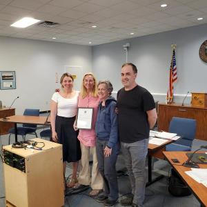 L-R: Councilor Nicole Kalloch and Mayor MacLellan-Ruf stand with Carol Loggia and Councilor Adam Lachman. (Photo courtesy City of Rockland)
