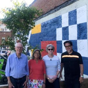 The Washington Street mural is finished in downtown Camden, thanks to painter Eric Eddy. Four members of the Camden Design Committee gathered by the mural June 23 to admire its completion: Richard Bernhard, Meg Quijano, Deb Dodge and Rafi Baeza.