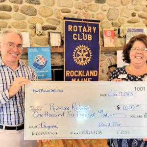 Dr. David Pier presents a check to Rockland Rotary President Tena Wallace. (Photo courtesy Rockland Rotary)