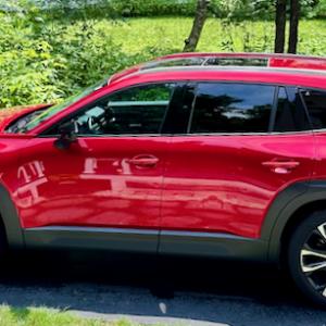 With the new-for-2023 CX-50, Mazda stakes out a spot at the upper end of the two-row SUV market. This color is Red Crystal Metallic.