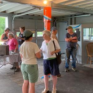 MFA’s Carly Williams (left) and MCHT’s Aaron Englander (right) connect with farmers and community members. Photos courtesy of Maine Farmland Trust
