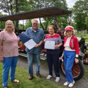 From left: Sonja Sleeper, Lady Knox Chapter DAR member, Warren Kincaid, Ground Vehicle Conservator at the Owls Head Transportation Museum, accepting his certificate of appreciation, Joanne Richards, Regent of Lady Knox Chapter DAR, and Joyce Davies, Vice Regent of Lady Knox Chapter DAR. Kincaid also accepted the certificate of appreciation on behalf of the museum. (Photo courtesy Mary Kelly)