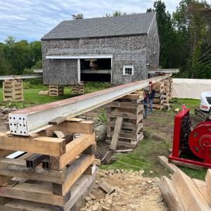 Don French’s barn at Lincolnville Beach is moved back from Route 1. (Photo by Diane O’Brien)