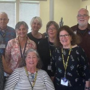 Incoming and Outgoing Belfast Senior College Board of Directors members at the 2023 BSC Annual Meeting. Top row, left to right: Mike Ray, Ron Jarvella, Marjorie Arnett, Doug Chamberlin, Jim Owen. Bottom row, left to right: Monica Morris, Denise Pendleton, Mayo Bulloch, Martha Laitin, Samantha Causon, seated at center, outgoing president Nancy Perkins. (Photo courtesy Belfast Senior College)