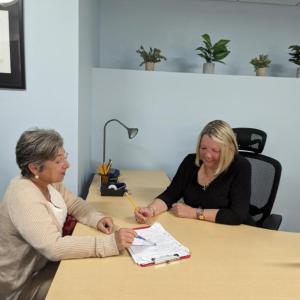 Friends of Rockland Public Library board members Deb Schilder and Jane Risley meet in The Office. (Photo courtesy Rockland Public Library)