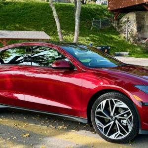 Hyundai’s Ioniq 6 electric sedan is an eye-catcher from every angle. Despite the sleek slope of the roof, there is generous space for two rear-seat passengers as well as a decent trunk.