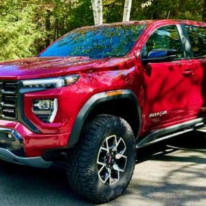 The AT4X package elevates (literally) the midsize Canyon pickup to the thin ranks of vehicles equally competent on pavement and off—if you can climb up into it. This color is Volcanic Red Tintcoat over an Obsidian Rush interior.