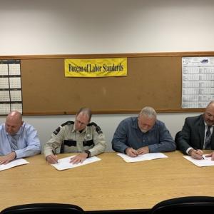 From left – Director of the Maine Fire Service Institute Jim Graves; Maine Forest Service Chief Ranger Robby Gross; Director of MDOL’s Workplace Safety and Health Division Steve Greeley; and State Fire Marshal Rich McCarthy. (Photo courtesy Maine Dept. of Labor)