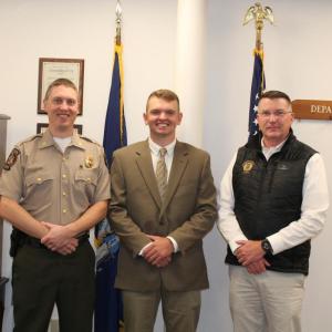 The newest Maine Marine Patrol Officer Amos Abbott, shown here with Colonel Matthew Talbot (left) and DMR Commissioner Patrick Keliher (right), will serve in the Friendship-Waldoboro-Cushing Patrol. (Photo courtesy Department of Marine Resources)