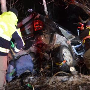 Rockport firefighters work quickly to stabilize the Jeep so that they can rescue the driver, as her vehicle hangs but five feet above the icy quarry. (Photo by Lynda Clancy)