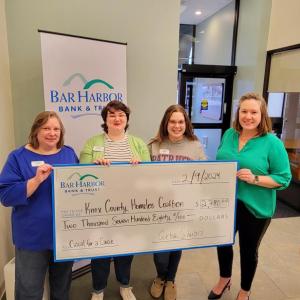 Bar Harbor Bank & Trust (BHBT) presents a donation from the Bank’s Casual for a Cause program to Knox County Homeless Coalition. Pictured from left to right: Hazel Young, AVP Branch Relationship Manager at BHBT; Elizabeth Bengtson, Customer Service Representative at BHBT; Gabriella Finn, Customer Service Representative at BHBT; and Rebecca Gildred, Chief Development Officer at Knox County Homeless Coalition. (Photo courtesy Bar Harbor Bank & Trust)