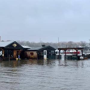 The ocean rose again to wash over seawalls and flood buildings along Bay View Street, in Camden, March 10, 2024.
