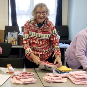 Betty Robshaw (Hancock County), Rita Fortin (Somerset County), and Mary Soper (Hancock County) package pajamas for delivery to local children. (Photo courtesy University of Maine Cooperative Extension)
