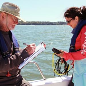 Volunteers with Coastal Rivers’ estuary water quality monitoring program take water samples and measurements to help people understand changing conditions. (Photo by Kris Christine)