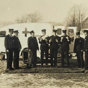 Camden Fire Department in 1936 with its new ambulance, a 1934 Ford. In their arms they hold then Fire Chief Allen Payson (he was alive, and no one can figure what they were doing, but likely they were laughing beneath their somber demeanor). From left to right, Joe Cote, Maurice Kennedy, Dick Damery, Clarence Mitchell, Clarence Thomas, Edwin Dodge, Hary Carl, A.B. Stevenson, Leon Poland, Percy Luce, Stan Dearborn, and Gene Thompson. The ambulance was housed on Washington Street across from the Town Office. (Photo courtesy Walsh History Center/Camden Public Library) Camden ambulance