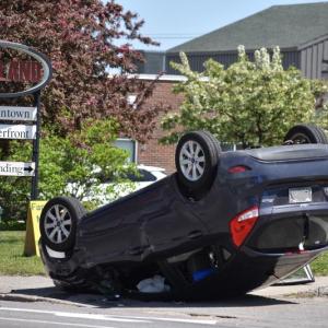 A car lands on its roof on Park Street only a few minutes after emergency personnel arrived to a prior crash on Talbot Avenue. (Photo by Sarah Thompson)