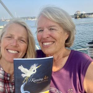 Patrisha McLean, CEO and founder of Finding Our Voices, with Adventurer Heidi Love, who will join the online discussion of her new book Laughing at the Sky in June's edition of the Finding Our Voices Bookclub. The book in the photo is a healing workbook penned by Heidi Love that the group distributes as a peer-support gift to Maine women survivors of domestic abuse. (Photo courtesy Finding Our Voices)