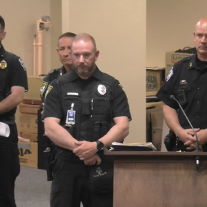 Belfast’s School Resource Officer Kevin Littlefield answers questions while Rockland Deputy Chief Alex Gaylor, Belfast Police Chief Bobby Cormier, and Rockland Police Chief Tim Carroll listen from behind.