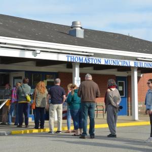 Citizens line up for Thomaston Town Meeting in 2023, where it was standing room only as the town debated several warrant articles. (Photo by Lynda Clancy)