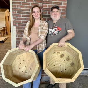 2024 Belfast Area High School graduate and Waldo County Technical Center's Building Construction student Kalli-Alexis Daley and Town of Brooks Selectman Mike Switzer with the planters Daley made for the town park. (Photo courtesy Waldo County Technical Center)