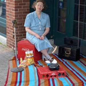 Liz McLeod has a summer picnic. (Photo courtesy Strand Theatre)