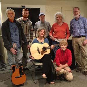 Left to right, the songwriters are Steve Chiasson, Tristan Lewis, Frank Boscoe, Ellen Berry, Ken Gross; and in the front row, Carol Graff and Liz Cunningham. (Photo courtesy Camden Public Library)
