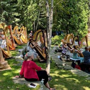 The Salzedo Harp Colony alumni ensemble grace the Camden Public Library Amphitheatre July 14 with a selection of music, including some original pieces by Carlos Salzedo. Conductor was Paula Page. (Photo by Lynda Clancy)