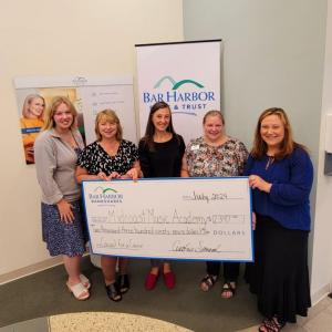 Bar Harbor Bank & Trust (BHBT) presents a donation from the Bank’s Casual for a Cause program to Midcoast Music Academy. Pictured from left to right: Dasha Schlicker, Customer Service Representative at BHBT; Lisa Veazie, SVP Regional Market Manager at BHBT; Alison Applegate, AVP Community Banking Relationship Manager at BHBT; Hazel Young, AVP Branch Relationship Manager at BHBT; and Jennifer Feldman, Executive Director at Midcoast Music Academy. (Photo courtesy BHBT)