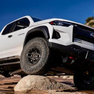 The Silverado ZR2 Crew in its natural habitat. Summit White (with a Jet Black and Graystone interior) makes the pair of bow-mounted red tow hooks pop.