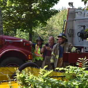 Long after the fire was knocked down, Hope and Lincolnville firefighters wait for the Fire Marshal’s Office. (Photo by Sarah Thompson)